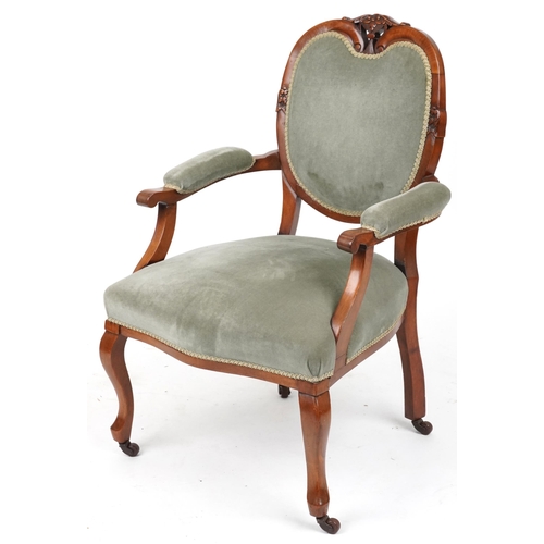 2134 - Victorian style armchair with olive green upholstery on cabriole legs with casters, 95cm high