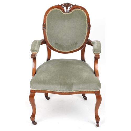 2134 - Victorian style armchair with olive green upholstery on cabriole legs with casters, 95cm high