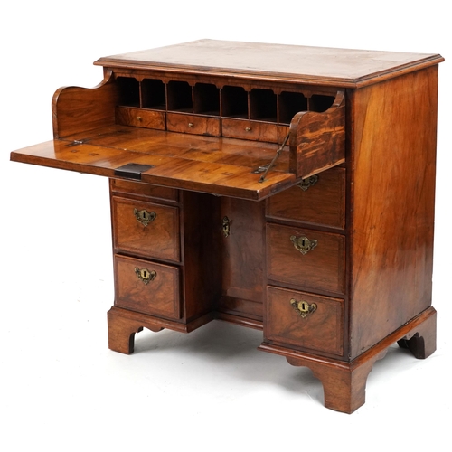 2019 - Antique figured walnut cross and feather banded kneehole secretaire desk fitted with an arrangement ... 