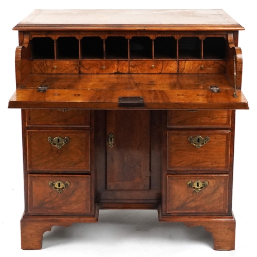 2019 - Antique figured walnut cross and feather banded kneehole secretaire desk fitted with an arrangement ... 