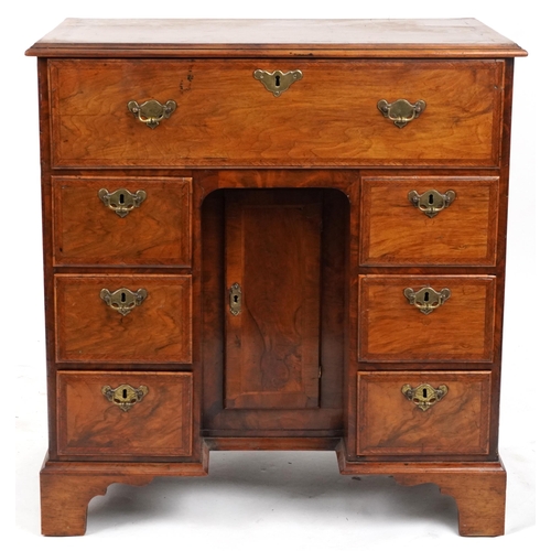 2019 - Antique figured walnut cross and feather banded kneehole secretaire desk fitted with an arrangement ... 