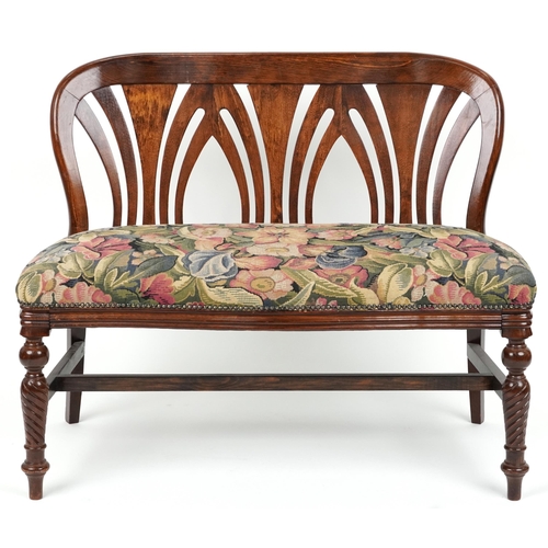 2056 - Stained wood two seater bench with floral upholstered seat on turned legs, 88cm H x 109cm W x 51.5cm... 