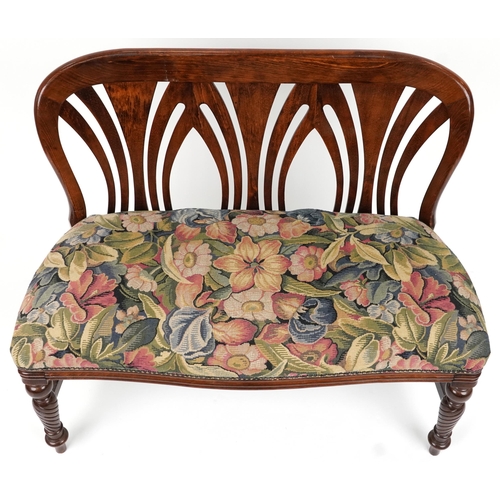 2056 - Stained wood two seater bench with floral upholstered seat on turned legs, 88cm H x 109cm W x 51.5cm... 