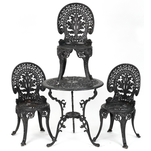 2154 - Black painted cast metal circular garden table with three chairs, 70.5cm high x 69cm in diameter