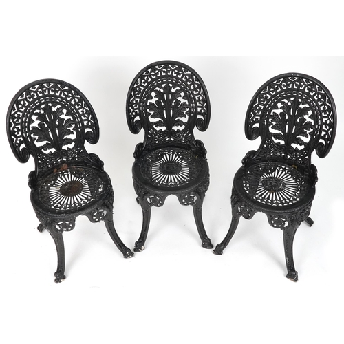 2154 - Black painted cast metal circular garden table with three chairs, 70.5cm high x 69cm in diameter