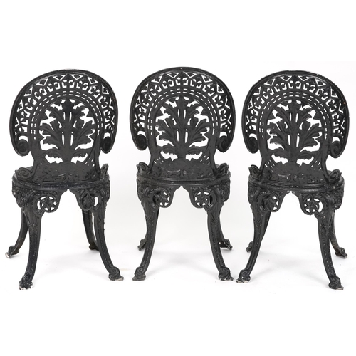 2154 - Black painted cast metal circular garden table with three chairs, 70.5cm high x 69cm in diameter