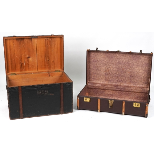 2092 - Two Victorian and later trunks including a metal studded wooden bound example dated 1859, the larges... 