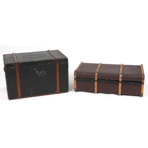 2092 - Two Victorian and later trunks including a metal studded wooden bound example dated 1859, the larges... 