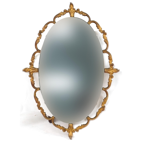 2167 - Ornate gilt framed wall mirror with oval bevelled glass, 66cm x 49cm