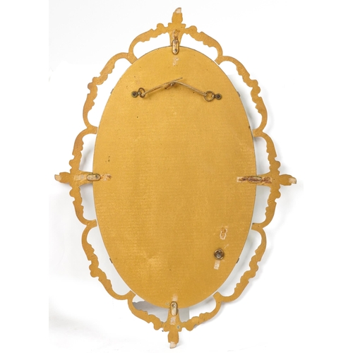 2167 - Ornate gilt framed wall mirror with oval bevelled glass, 66cm x 49cm