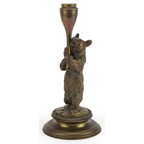 171 - Victorian brass candlestick in the form of a bear hugging a trunk, 23cm high