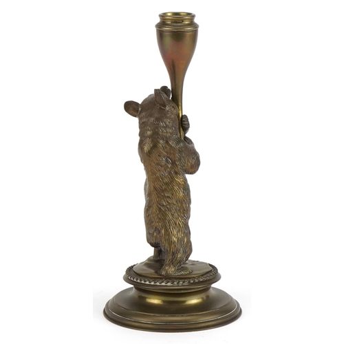 171 - Victorian brass candlestick in the form of a bear hugging a trunk, 23cm high