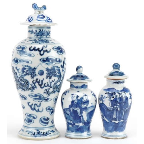 724 - Three Chinese blue and white porcelain baluster vases with covers including one hand painted with tw... 