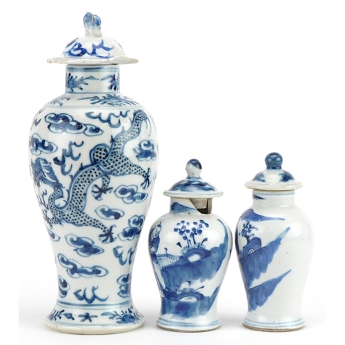 724 - Three Chinese blue and white porcelain baluster vases with covers including one hand painted with tw... 