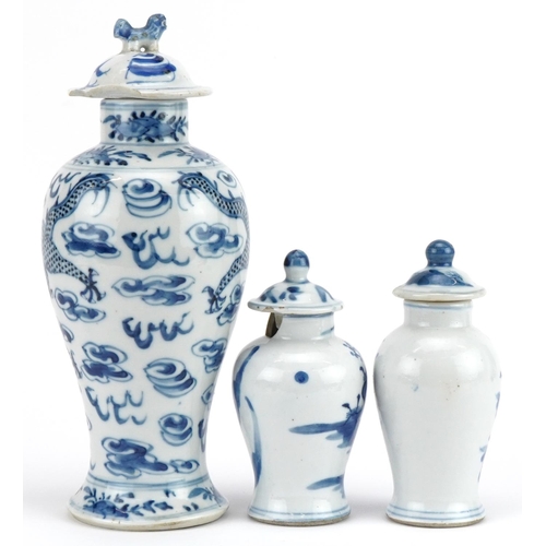 724 - Three Chinese blue and white porcelain baluster vases with covers including one hand painted with tw... 