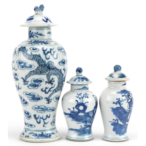 724 - Three Chinese blue and white porcelain baluster vases with covers including one hand painted with tw... 