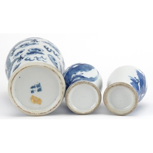 724 - Three Chinese blue and white porcelain baluster vases with covers including one hand painted with tw... 