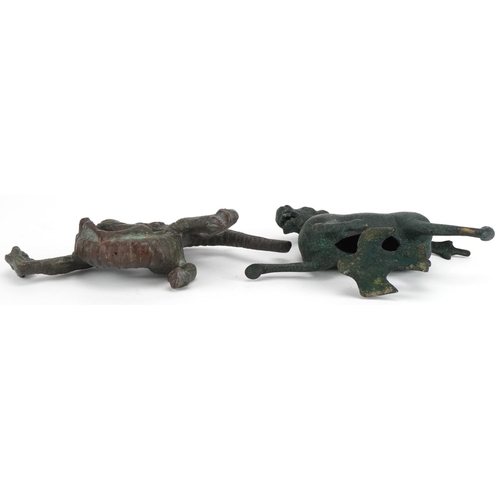 533 - Two Chinese archaic style verdigris cast metal animals including a dragon, each raised on hardwood b... 