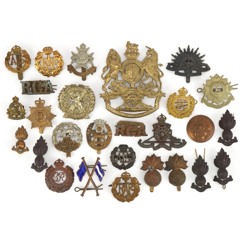 1380 - British military cap badges and a Victorian Royal Field Artillery helmet plate, the cap badges inclu... 