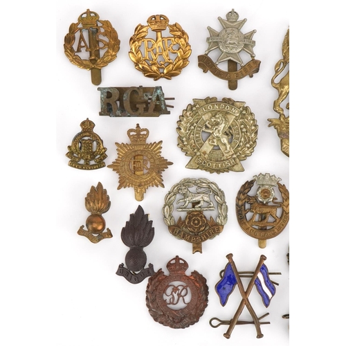 1380 - British military cap badges and a Victorian Royal Field Artillery helmet plate, the cap badges inclu... 