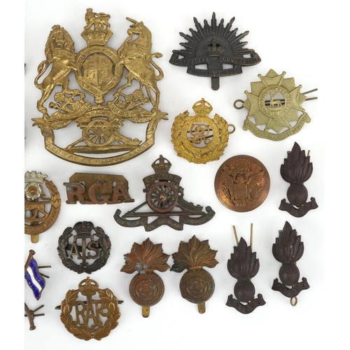 1380 - British military cap badges and a Victorian Royal Field Artillery helmet plate, the cap badges inclu... 