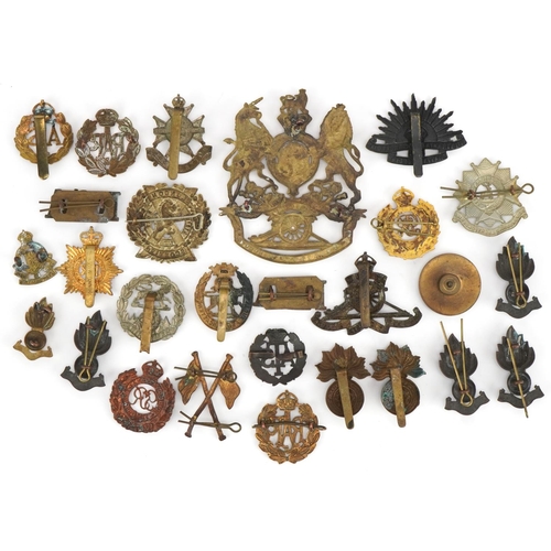 1380 - British military cap badges and a Victorian Royal Field Artillery helmet plate, the cap badges inclu... 