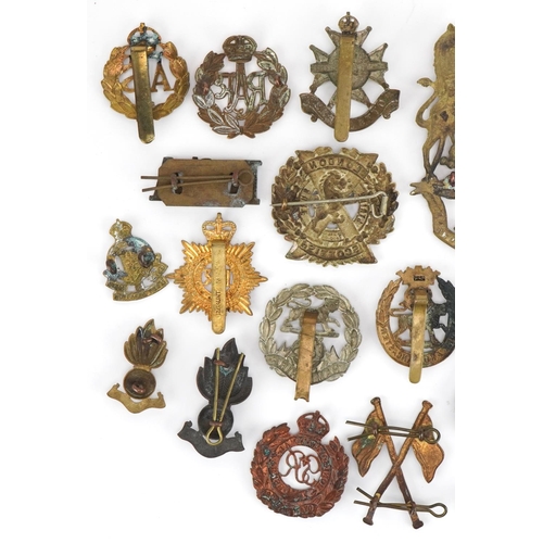 1380 - British military cap badges and a Victorian Royal Field Artillery helmet plate, the cap badges inclu... 