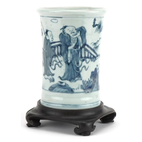 460 - Chinese blue and white brush pot on hardwood stand hand painted with figures in a landscape, overall... 