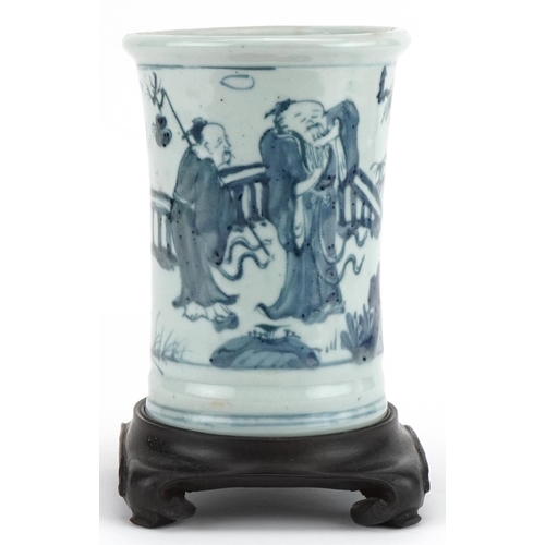 460 - Chinese blue and white brush pot on hardwood stand hand painted with figures in a landscape, overall... 