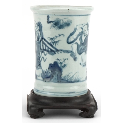 460 - Chinese blue and white brush pot on hardwood stand hand painted with figures in a landscape, overall... 