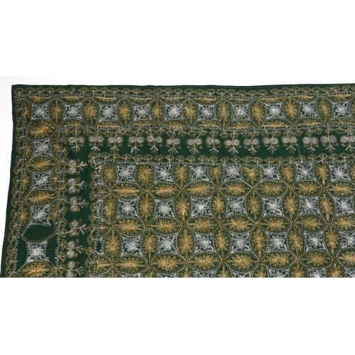 426 - Large Indian green ground textile finely embroidered with flowers, 245cm x 137cm