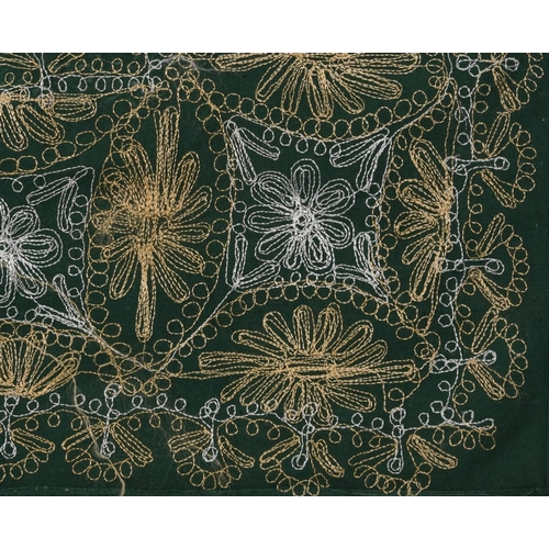 426 - Large Indian green ground textile finely embroidered with flowers, 245cm x 137cm