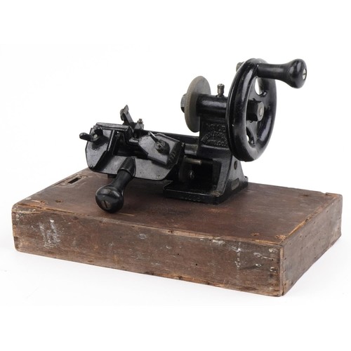 381 - Early 20th century Yale cast iron key cutting machine on rectangular wooden base, overall 34cm wide