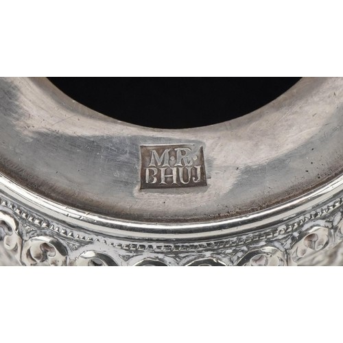 100 - Bhuj, Indian Kutch silver cylindrical pot with hinged lid profusely pierced and embossed with stylis... 