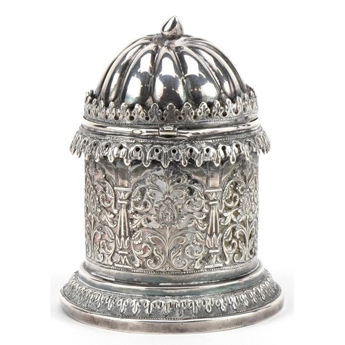 100 - Bhuj, Indian Kutch silver cylindrical pot with hinged lid profusely pierced and embossed with stylis... 