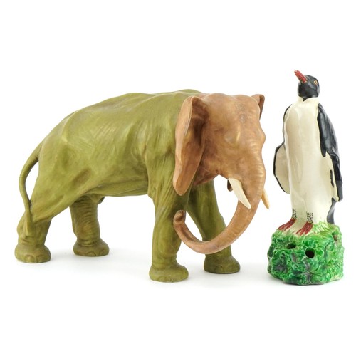 542 - Royal Dux porcelain elephant and a Bretby pottery pen stand in the form of a penguin, the largest 26... 