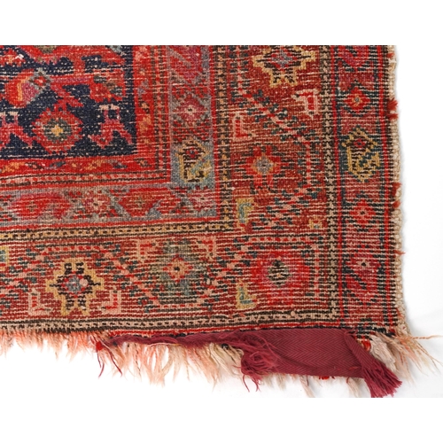 2185 - Rectangular Persian red and blue ground carpet runner having an allover floral repeat central field,... 