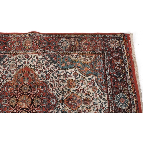 2191 - Rectangular Persian rug with red ground border having and allover repeat floral design, 190cm x 135c... 