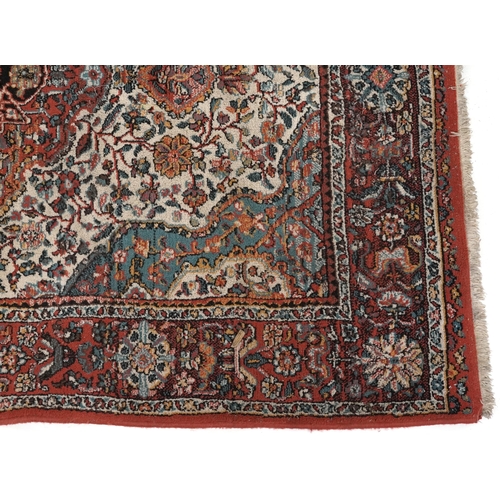 2191 - Rectangular Persian rug with red ground border having and allover repeat floral design, 190cm x 135c... 