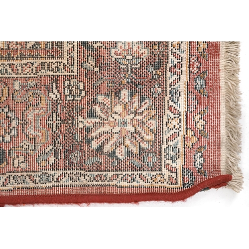 2191 - Rectangular Persian rug with red ground border having and allover repeat floral design, 190cm x 135c... 