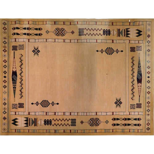 2193 - Rectangular Aztec style beige ground rug having and allover repeat design, 300cm x 202cm