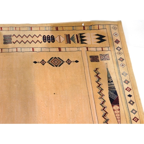 2193 - Rectangular Aztec style beige ground rug having and allover repeat design, 300cm x 202cm