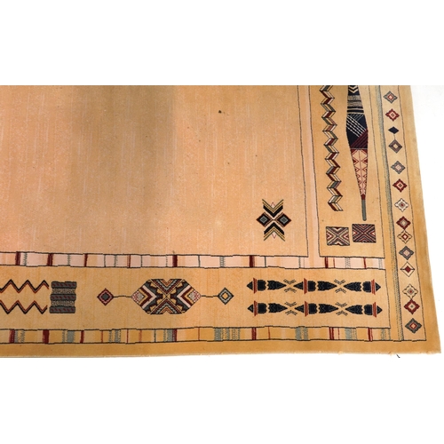 2193 - Rectangular Aztec style beige ground rug having and allover repeat design, 300cm x 202cm