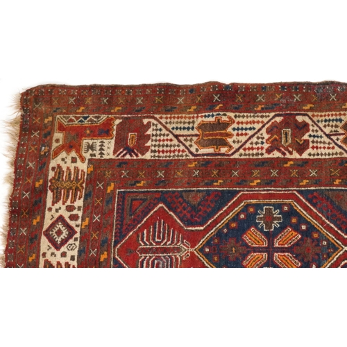 2190 - Rectangular Turkish red ground rug having an allover repeat floral design, 258cm x 132cm