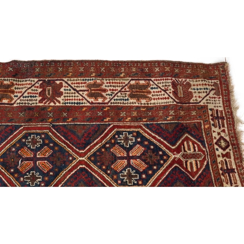 2190 - Rectangular Turkish red ground rug having an allover repeat floral design, 258cm x 132cm