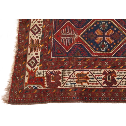 2190 - Rectangular Turkish red ground rug having an allover repeat floral design, 258cm x 132cm