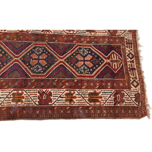 2190 - Rectangular Turkish red ground rug having an allover repeat floral design, 258cm x 132cm