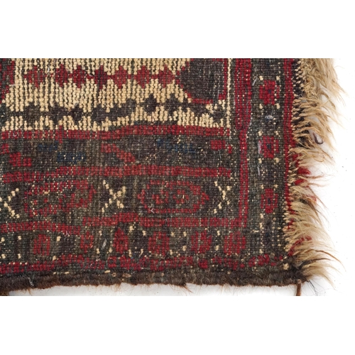 2190 - Rectangular Turkish red ground rug having an allover repeat floral design, 258cm x 132cm