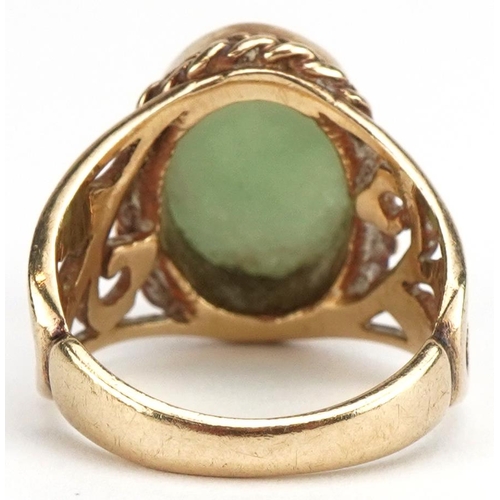 3177 - 9ct gold cabochon green jade ring with pierced floral shoulders, size N, 7.3g