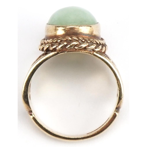 3177 - 9ct gold cabochon green jade ring with pierced floral shoulders, size N, 7.3g